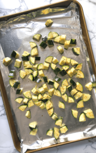 cubed zucchini raw on tray