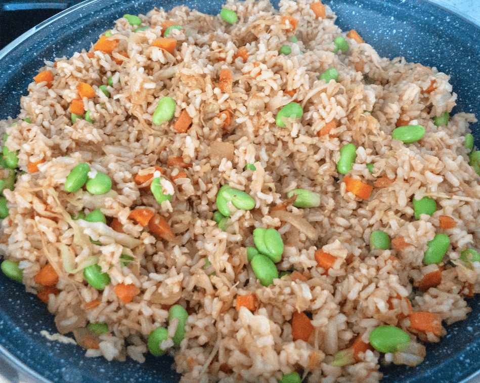 cooked rice & vegetables in a pan with asian flavors