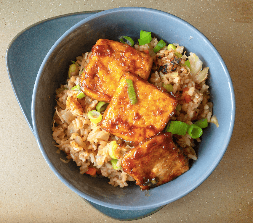 Fried rice topped with crispy tofu