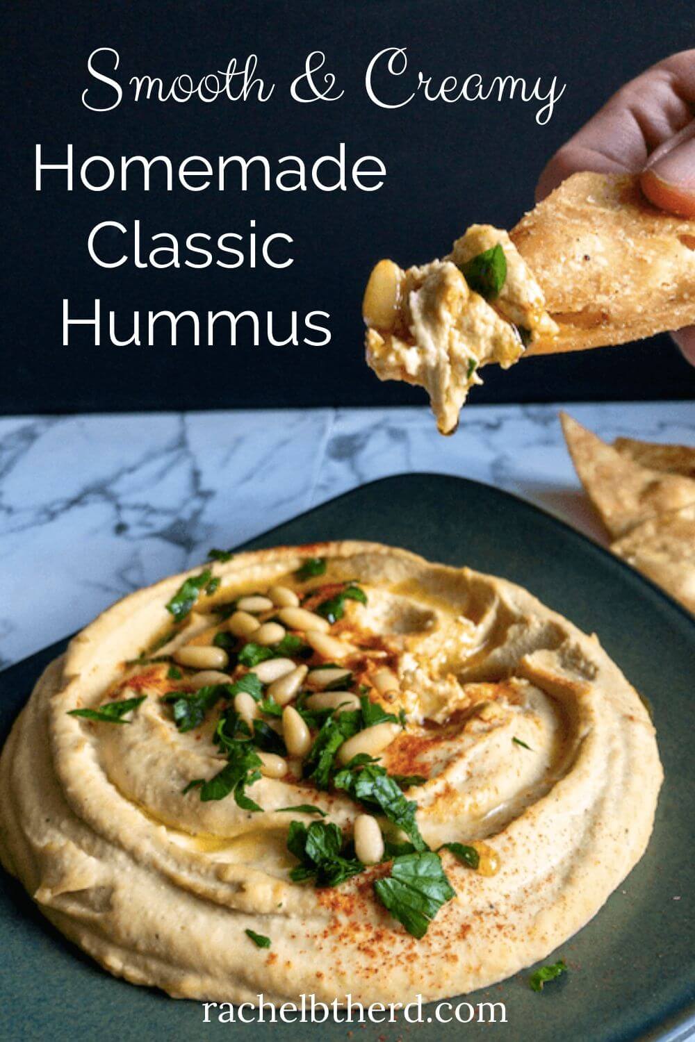 Homemade classic hummus with dip on a chip