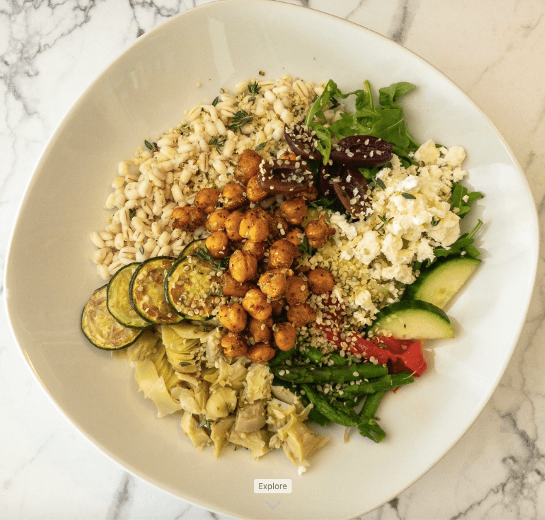 adding garnishes and toppings to grain bowl