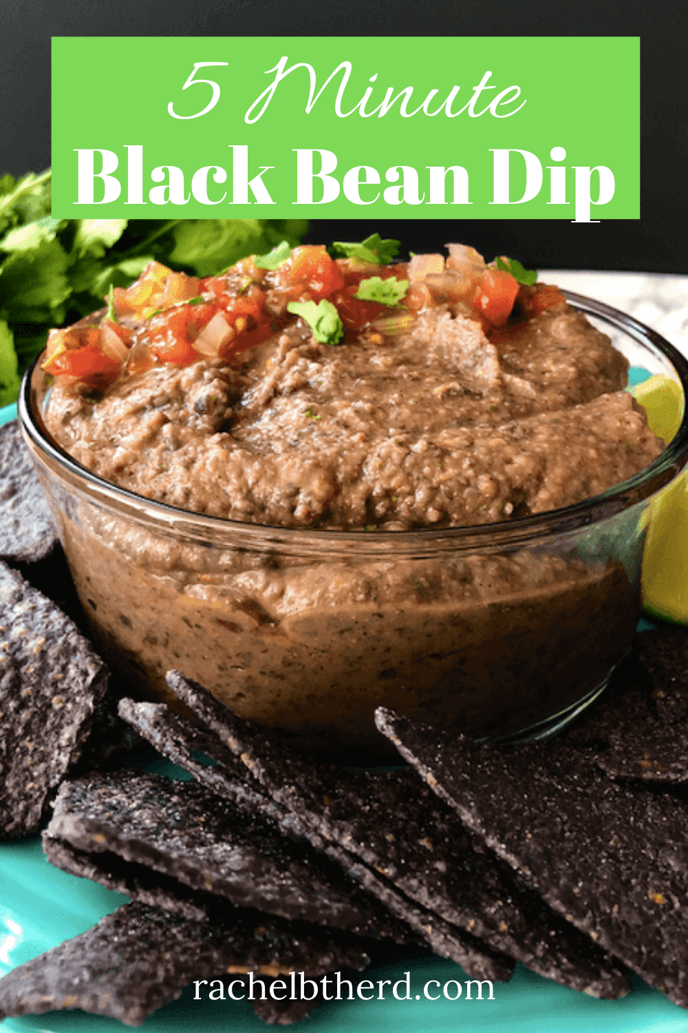 Black Bean Dip with tomatoes sprinkled on top served with tortilla chips