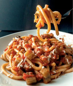 Pasta Puttanesca on a fork