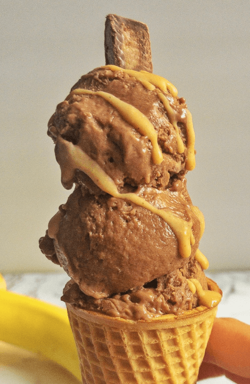 peanut butter cup on top of ice cream cone