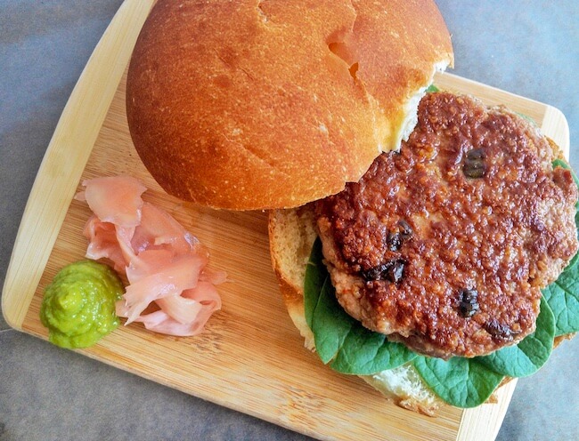 fish burger on a bun with pickled ginger & wasabi