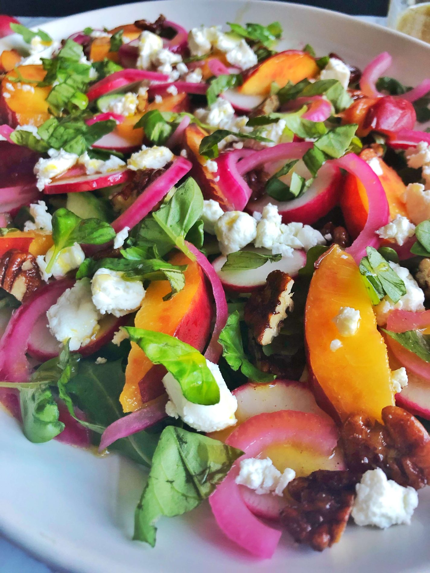 up close nectarine , arugula, goat cheese