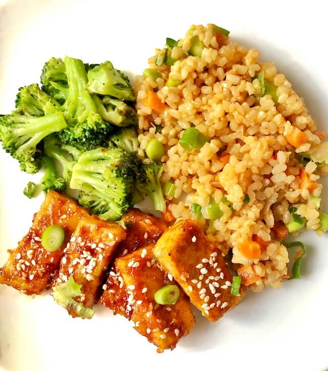 tofu served with fried rice with broccoli