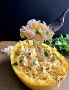 fork full of spaghetti squash with parmesan and garlic