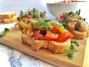 crostini with eggplant caponta and basil