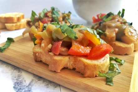 crostini with eggplant caponta and basil