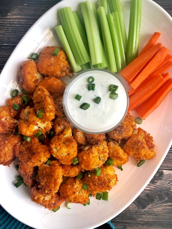 cauliflower with buffalo sauce and ranch with side of carrots and celery