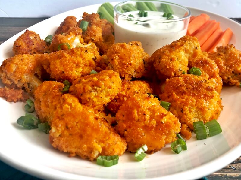 plated cauliflower wings with buffalo sauce