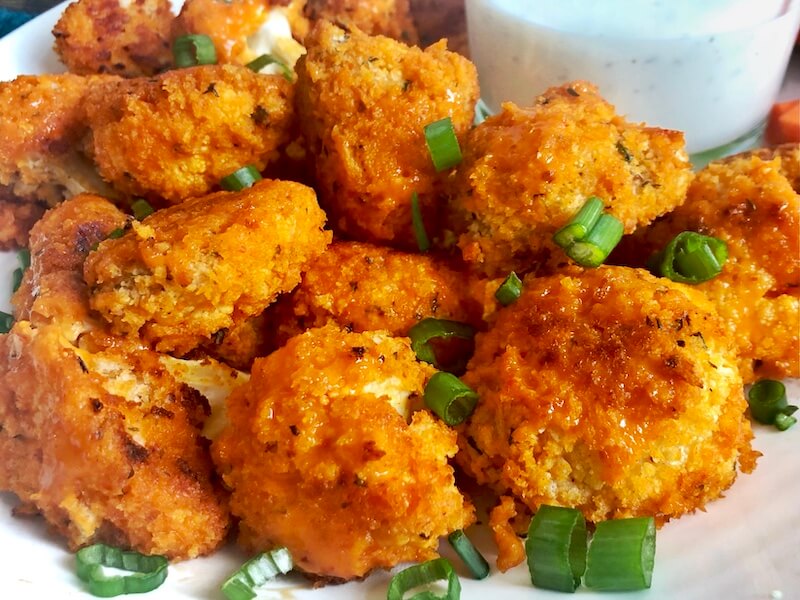 up close roasted cauliflower with buffalo sauce