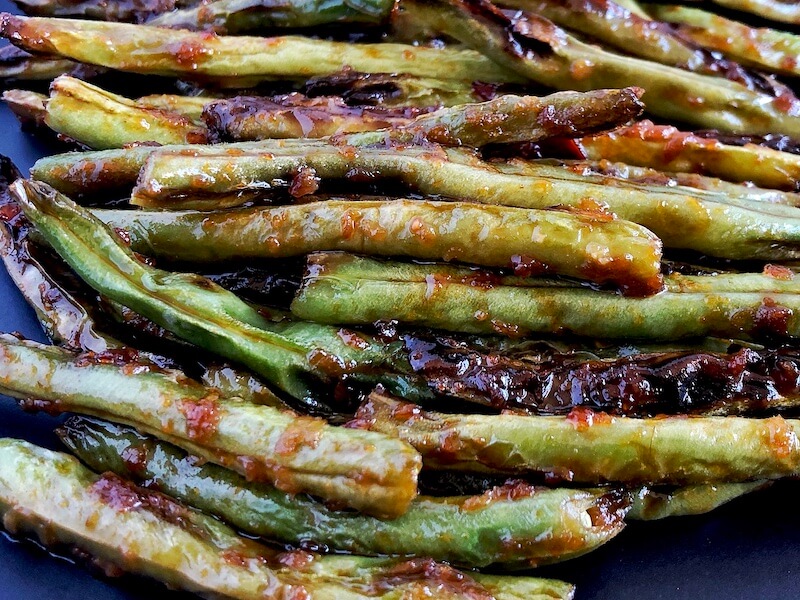 close up string beans with asian sauce