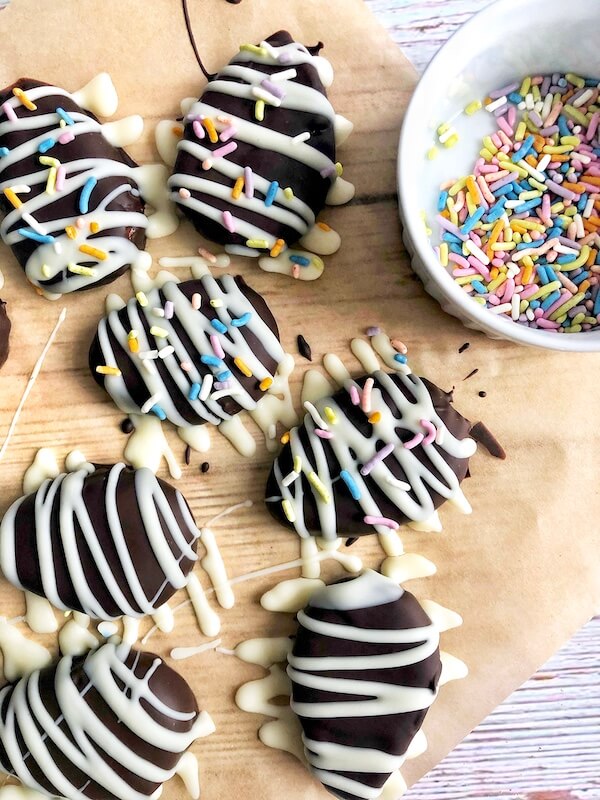 decorating homemade chocolates with peanut butter