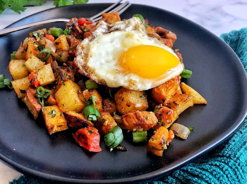 fried egg over breakfast hash- side view