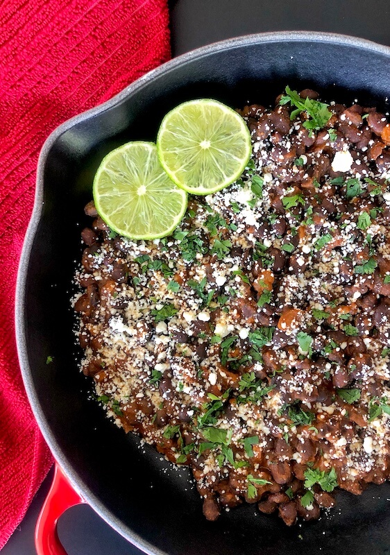 skillet of black beans with chili spices
